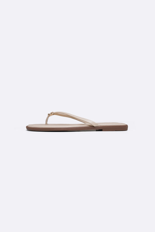 BEIGE STUD STUFF FLIP FLOPS