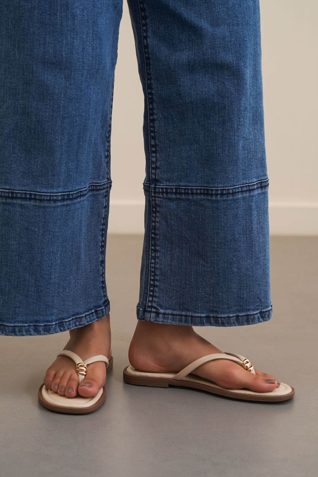 BEIGE STUD STUFF FLIP FLOPS