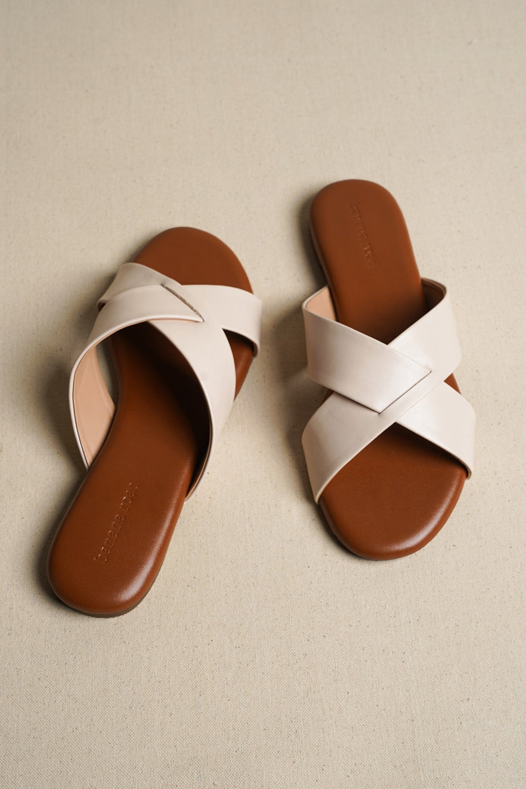 OFF WHITE CROSS STRAP SLIDES