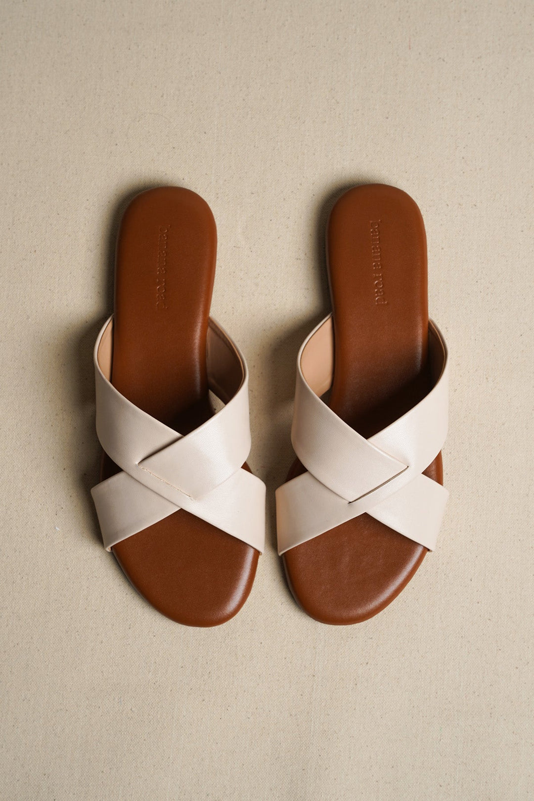 OFF WHITE CROSS STRAP SLIDES